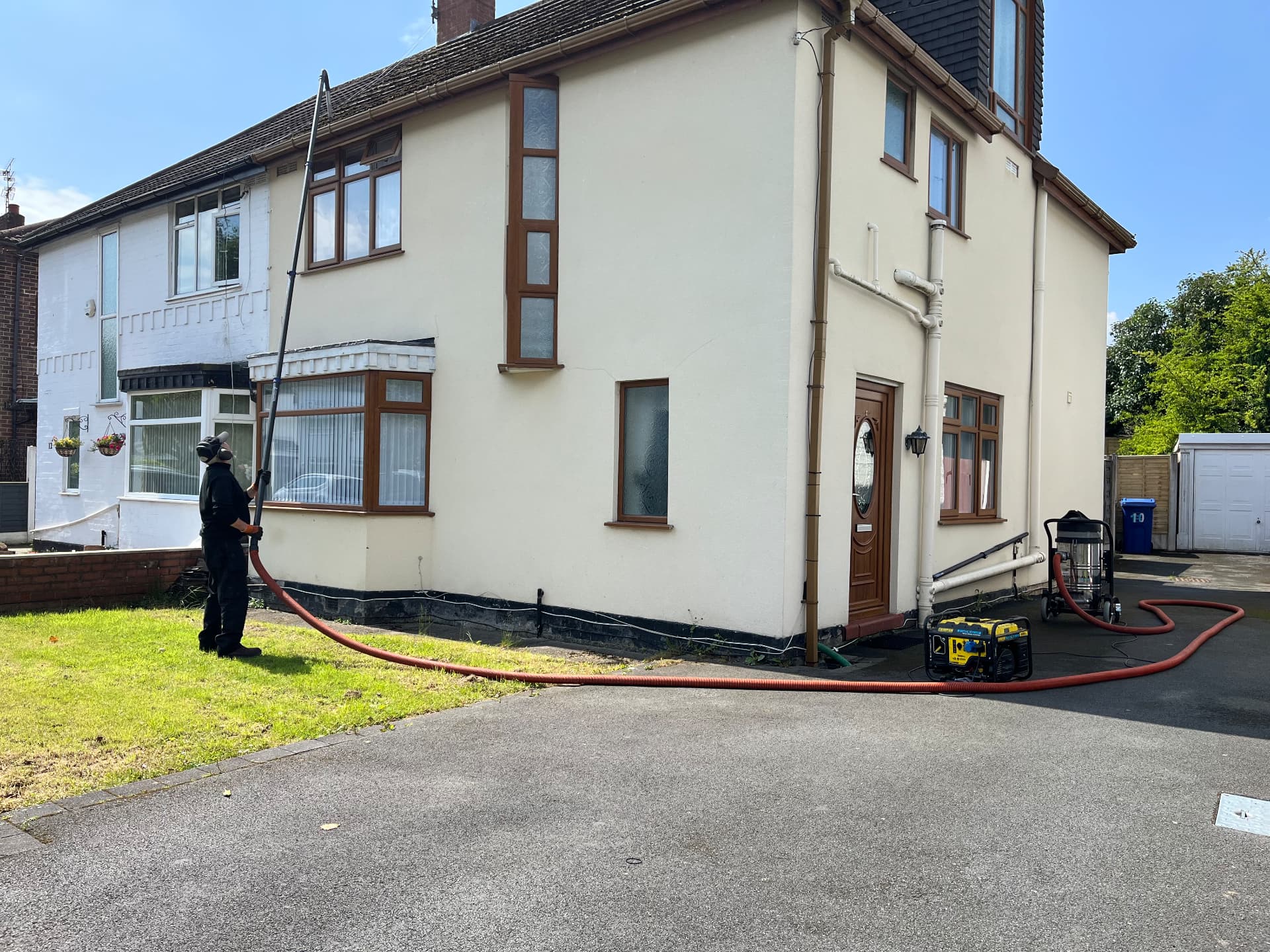 High-reach exterior cleaning at a residential building